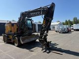 a picture of a volvo construction vehicle parked in a parking lot