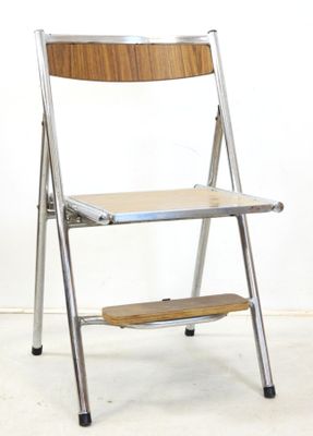 a chair that has a step stool on it