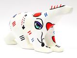ceramic figurine of a cat with red, white, and blue eyes