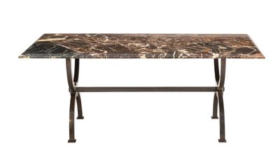 a marble top table with metal legs and a black base