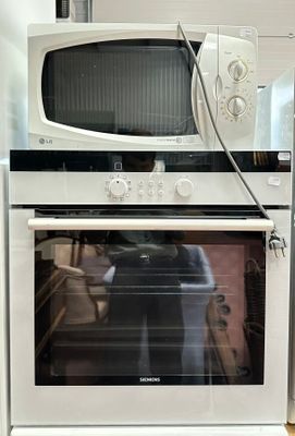 a microwave and a microwave oven in a kitchen