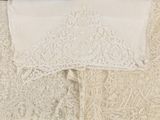 a close up of a dress on a hanger on a wall
