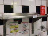 a picture of a commercial kitchen with stainless steel shelves