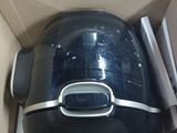 a black and silver toaster sitting inside of a box