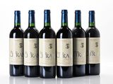 six bottles of red wine are lined up in a row
