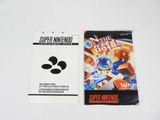 a close up of a nintendo wii game next to a card