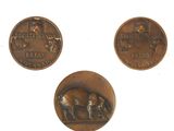 three different types of coins are shown on a white surface