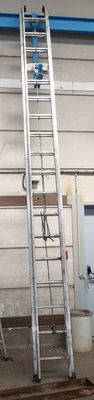 many ladders that are sitting in a building