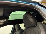 an image of a car with the sunroof down