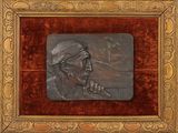 painting of a man smoking a cigarette in a wooden frame