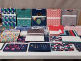 several different types of fabric are on a table with a white table cloth