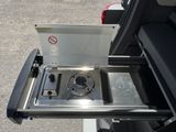 a small stove in the back of a van