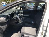 the interior of a car with the driver ' s seat folded down