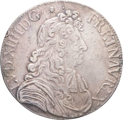 Gros plan sur une pièce de monnaie portant le visage d'un homme