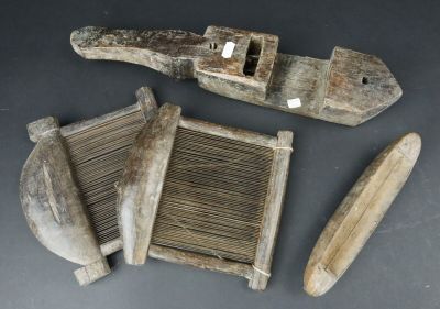 two pieces of wood that have been carved into the shape of a boat