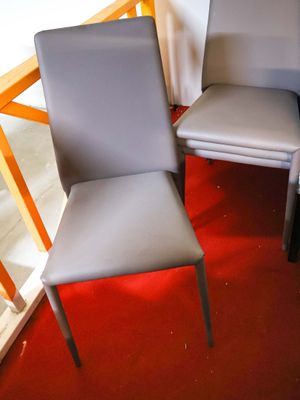 two chairs sitting next to each other on a red carpet