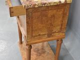 a small wooden table with a drawer on top of it