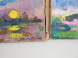 two paintings that are on the wall of a room