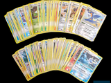 a lot of pokemon cards on a black background