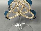 a wine glass with a blue and gold decoration on it