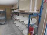 many plates on the shelves in the room