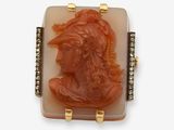 an image of a carved cameo of a woman wearing a hat