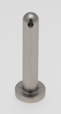 a close up of a metal object on a white surface