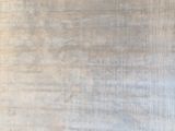 a piece of cloth hanging on a wall next to a window