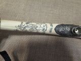 a close up of a baseball bat with a design on it