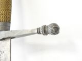 a close up of a sword with a metal handle