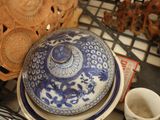 a blue and white bowl sitting on top of a table