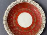 two plates and a bowl sitting on a table
