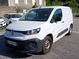 a white van that is parked on the side of the road