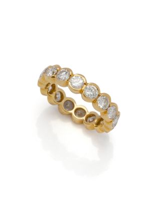 an 18k gold and diamond eternity ring