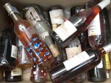 many bottles of wine sitting in a cardboard box