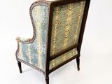 an image of a chair with a blue and yellow upholstered upholstered back