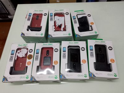 boxes of cell phones sitting on top of a table next to each other