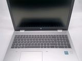 an open laptop computer sitting on top of a white table