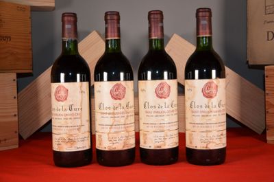three bottles of red wine are lined up on a table