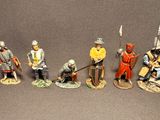 seven figurines of men dressed in medieval clothing