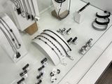 a display case with many different types of jewelry on it