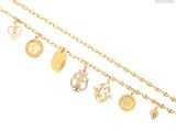 a close up of a gold chain with various charms on it