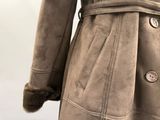 a coat with a fur collar on a mannequin mannequin