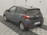 a picture of a car in a garage with a checkered floor