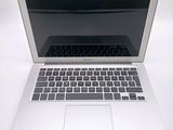 a white laptop computer sitting on a white surface