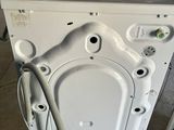 a washing machine that is sitting in the garage