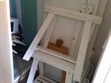a white easer that is in the corner of a room