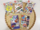 nintendo wii games are arranged on a wicker tray on a table
