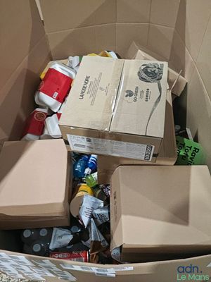 a cardboard box filled with various items in it