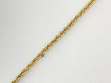 un bracelet en or en forme de corde, muni d'un fermoir serti d'un diamant